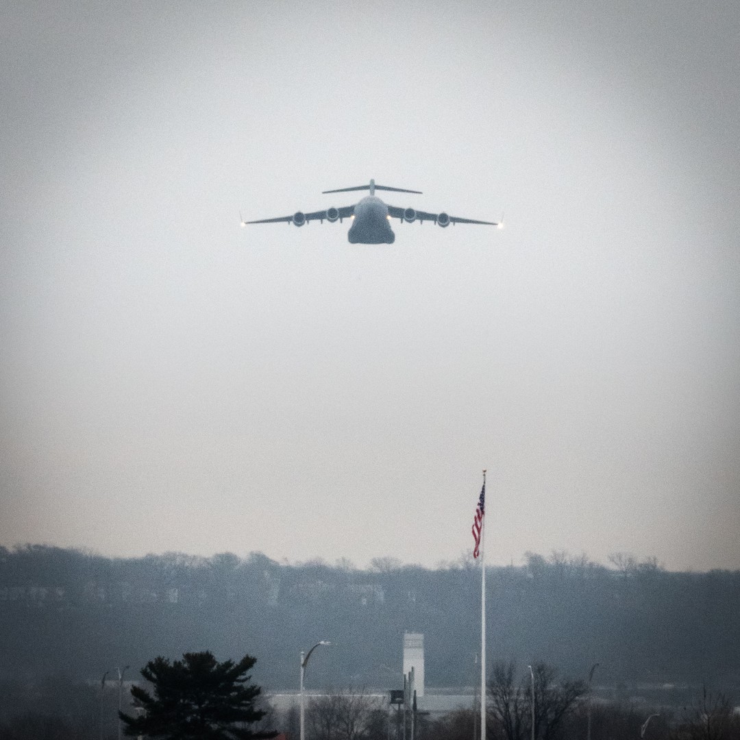 A US Air Force C-17 Globemaster on approach to preforming a flyover at Arlington Cemetery for Major General Marcelite J. Harris service with a Pentagon flag and the control tower for NAS Anacostia at the bottom of the frame @usairforce @arlingtonnatl 
#Arlington⠀
#ArlingtonMedia⠀
#ArlingtonCemetery⠀
#ArlingtonNationalCemetery⠀