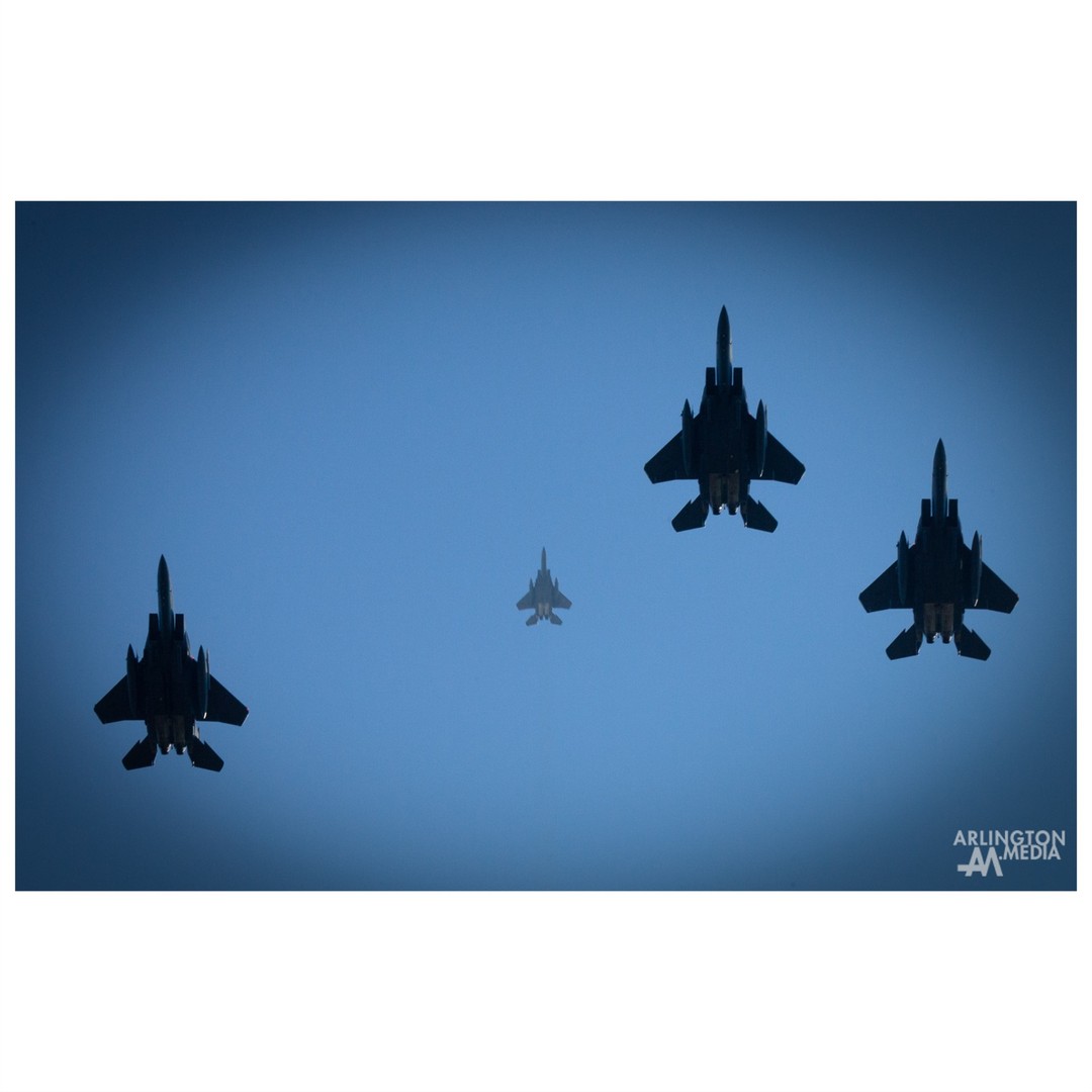 A unique view looking straight up of four @usairforce F-15E Strike Eagles flying directly over an Arlington Cemetery service while performing the missing man formation aerial salute. The service was covered by Arlington Media for the family.