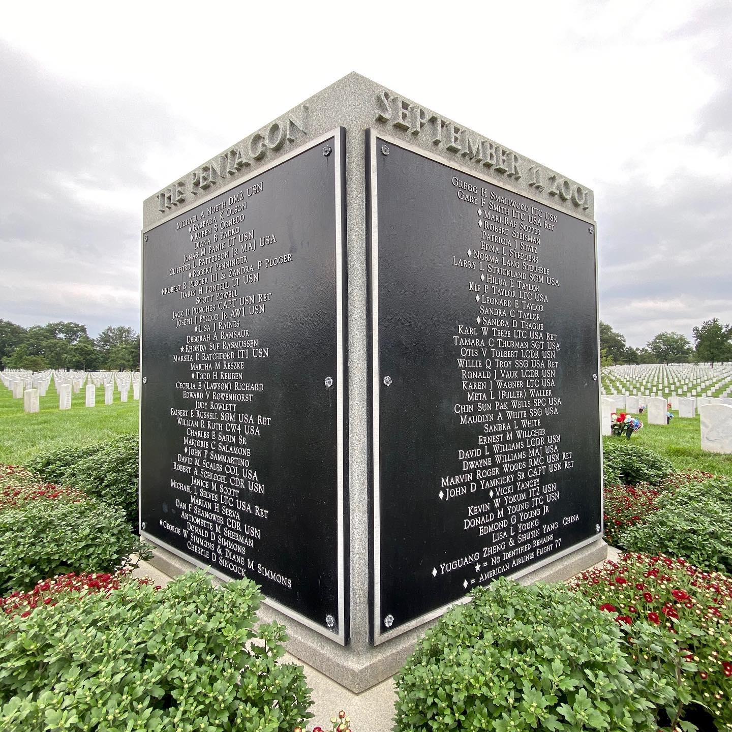 Rising up from Section 64 in there can be seen a Group Burial Marker.  This Marker denotes the final resting place of the 184 victims of the September 11, 2001 attack on the Pentagon. ⠀
⠀
This marker was placed in the section where victims from the Pentagon attack are buried -- the section that lies closest to the Pentagon to this day.⠀
⠀
This 5-sided granite marker stands over the gravesite and bears the names of ALL the heroes that perished in the Pentagon and those aboard American Airlines Flight 77.