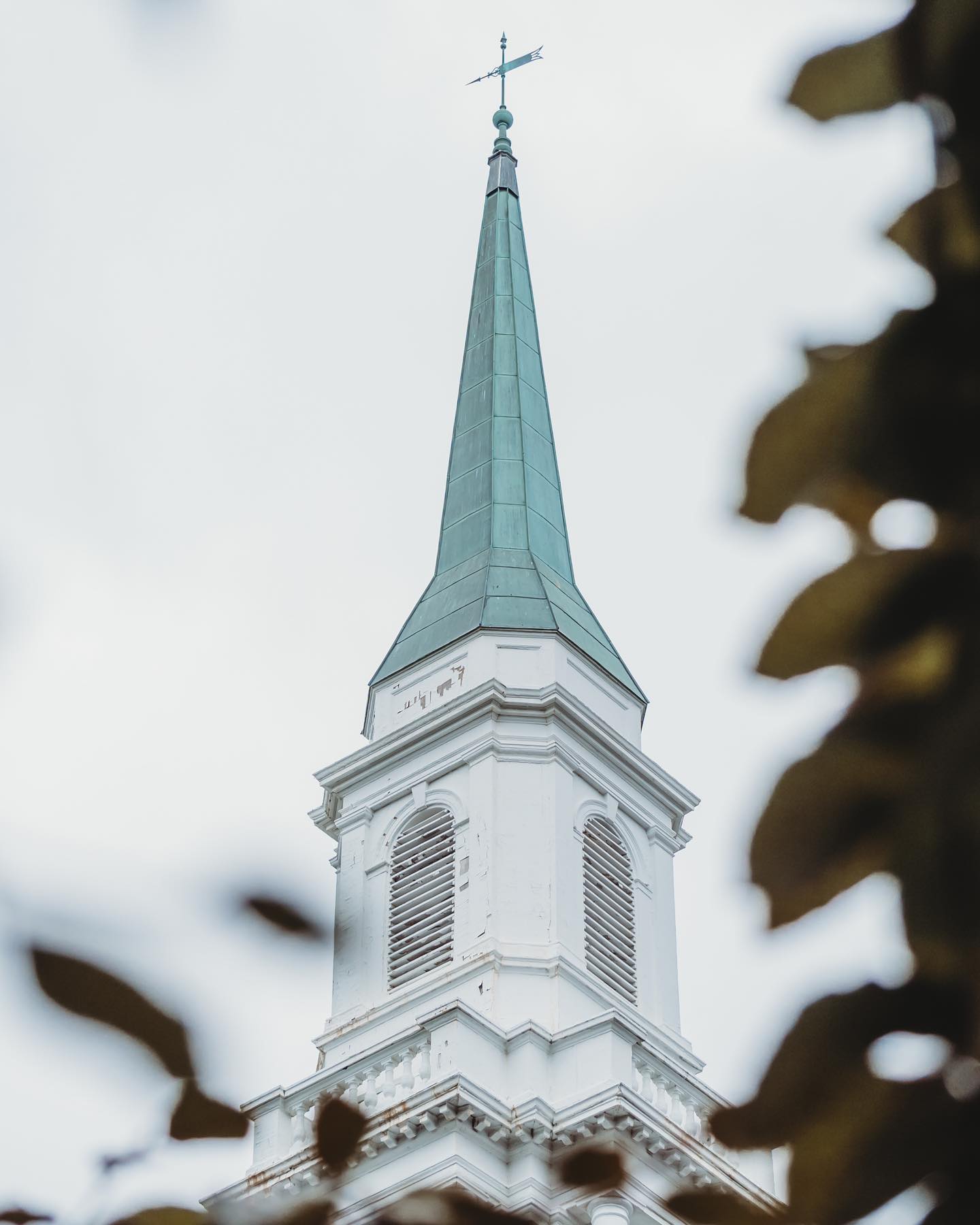 On a rainy day, the spire of the Old Post Chapel can be seen rising above Fort Myer Henderson Hall, towards the clouds.

The spire is clothed in a patina, that has developed through years of exposure to the elements.  A patina is something transformed beautifully through age or use.  This spire is a representation of all those that pass beneath it.  Soldiers, veterans, families, spouses, and friends that support a higher purpose, an honor, and a duty.

Serving our country each and every day.
