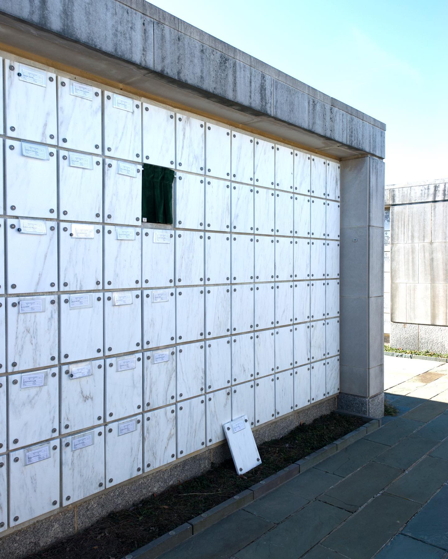 A lone space at the Columbarium stands open.

A veterans final resting place.

No space in Arlington National Cemetery can be bought, they can only be earned through the selfless service and sacrifice of veterans past, present, and future.