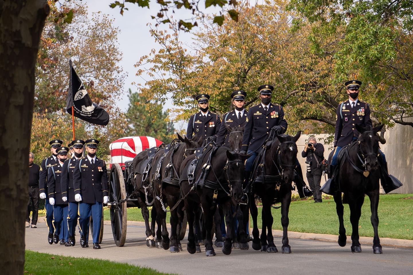 The caisson platoon conducts an average of 1,700 funerals per year between all five branches of the services. The honor is reserved for all officers, warrant officers, sergeant major (E-9, the highest enlisted rank), with priority given to those killed in the line of duty.

A typical caisson team consists of a minimum of seven horses, matched gray or black, four riders, and a serviceman displaying the colors of the deceased members branch of service. 

Six of the horses pull the caisson, three of which have riders. The three other horses are riderless. The two horses closest to the caisson are called the wheel horses, and these are the most experienced horses and act as the brakes. The two front horses are the leads, and they are the second most experienced. The two middle horses are called the swings, and they are the least experienced. The seventh horse, which has a rider, is the guide horse.

The seventh horse is ridden off the team to allow the section chief to move independently, ensuring that the designated route is clear, and to coordinate with the marching troops prior to the funeral service. In battles, the horses on the right side were used for carrying provisions and replacing a main horse if needed. 

Caissons were used to carry the wounded and deceased from the battlefield as well as hauling ammunition. The field artillery used a six-horse hitch, and today, the platoon uses their equipment, tack, techniques, and training methods laid out in the artillery manual printed by the Army in 1942.

PC: @arlingtonmedia