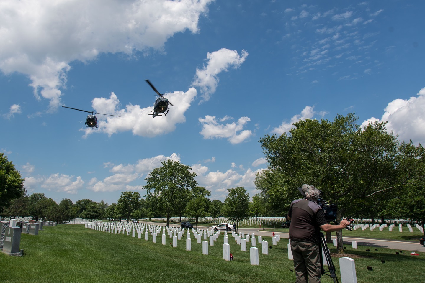 Huey helicopters, or Army UH-1 Iroquois helicopters fly over Clifford Crittenden of Arlington Media during a service we were covering earlier this year.