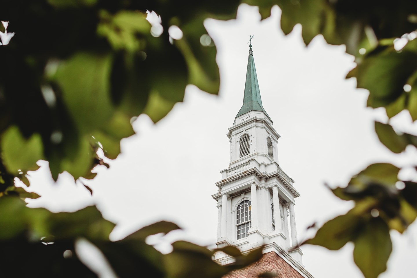 The steeple of the Old Post Chapel at Fort Myer in Arlington Virginia can be seen rising up through the foliage.  This chapel also houses an incredible organ.

The Old Post Chapel at Fort Myer, Virginia, is the ceremonial chapel for Arlington National Cemetery. It is used for over 600 funerals and memorial services per year-an astounding number compared to most civilian churches. Most world religions have used the chapel, and nearly every U.S. President has attended services in the Old Post Chapel. 

Nationally prominent clergy such as Evangelist Billy Graham, Lutheran Hour preacher Oswald Hoffman, and Roman Catholic Cardinals Spellman, Cooke and John O'Connor have presided and preached in the chapel. In addition to funerals, the chapel is used for over 300 weddings and special services annually.

In addition to being one of the most used instruments in the country, the organ in the Fort Myer Old Post Chapel is of significant historical value. It was originally installed by the M. P. Möller Company in 1935. Allen Organ Company, in conjunction with Lewis and Hitchcock, Inc. Pipe Organ Company of Maryland, recently completed the restoration and updating of this historic instrument in recent years and the new organ honors service members and veterans in memorial services every week.