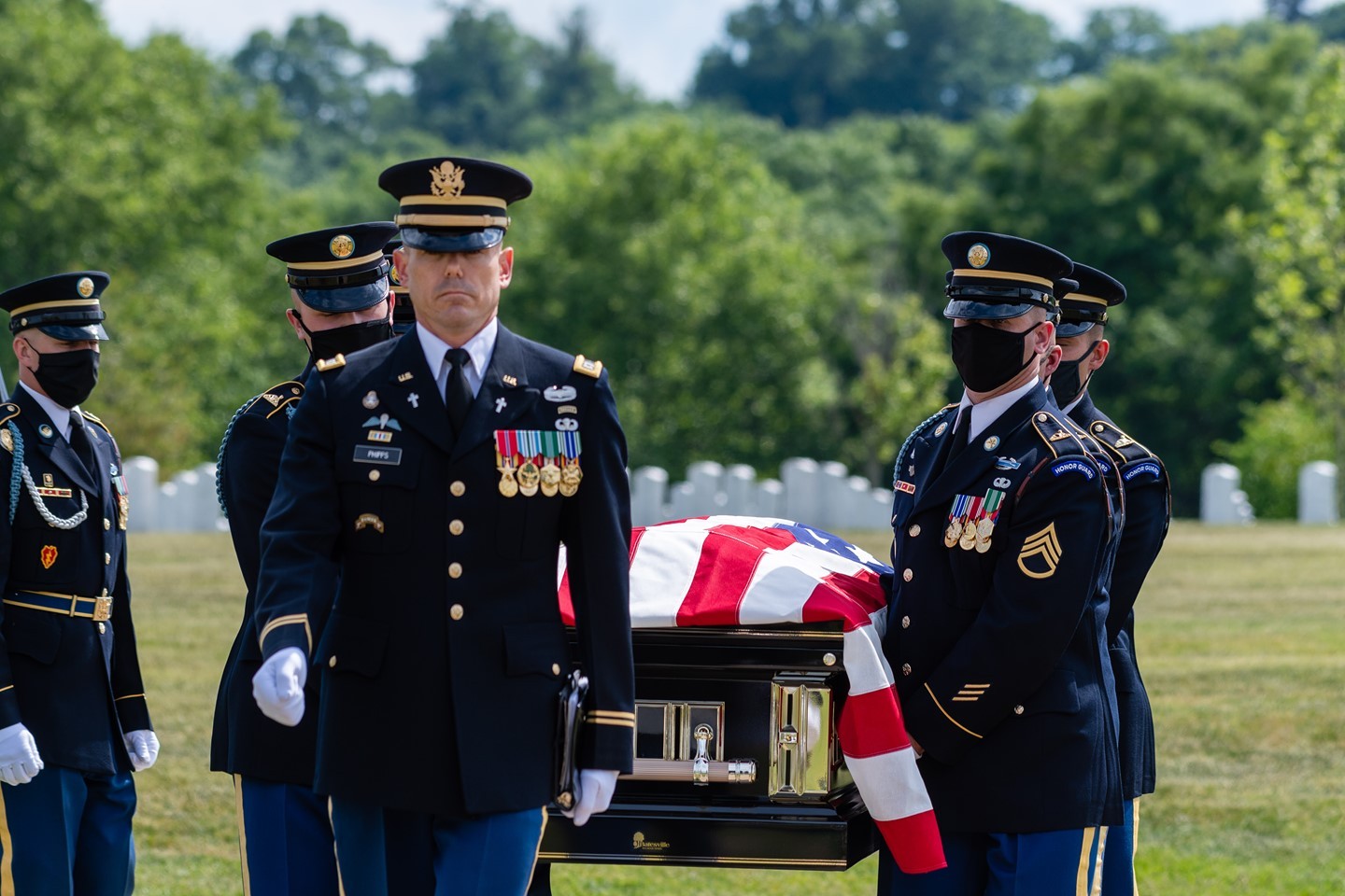 A US Army Chaplain escorts the remains of an American hero to their final resting place in Section 57 of Arlington National Cemetery.