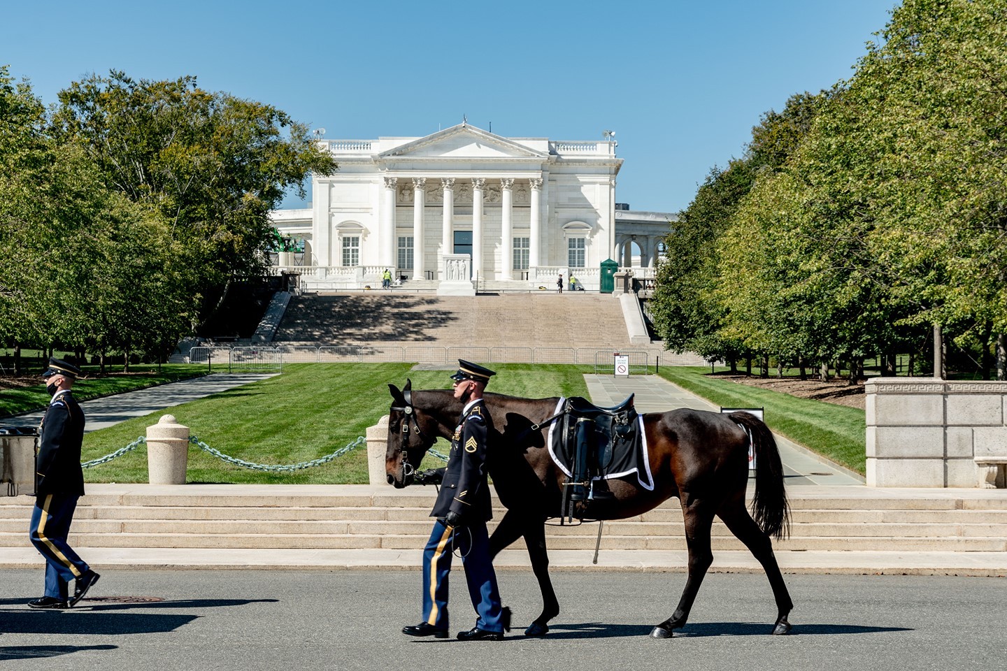 The caparisoned horse is walked in front of the Tomb of the Unknown Soldier at Arlington National Cemetery in Arlington, Virginia. 

The Third Infantry Regiment United States Army, more commonly known as the Old Guard, is always responsible for the caisson. Caisson is a horse drawn wagon or cart. The two caissons used at the Cemetery are from the WWI time period circa 1918-1919. Originally the caisson was used to bring artillery onto the battlefield. Once the artillery was off-loaded, the caisson was loaded with bodies of fallen service members. The wagon is pulled by six horses, but there are only three riders. The Old Guard service members only ride the horses on the left side because the horses on right side were originally used to take supplies onto the battlefield.

Officers with a rank of colonel or above in the Army and the Marine Corps may have a caparisoned (riderless) horse, if available. The riderless horse follows behind the caisson and is guided by an Old Guard service member. The horse wears an empty saddle with the boots in the stirrups backwards to signify the last ride of the officer.