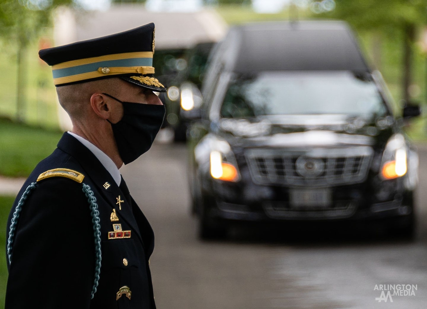 The former commander of the 1st BN, 3rd Infantry Regiment awaits the arrival of a funeral procession to honor an American Hero at Arlington National Cemetery.
