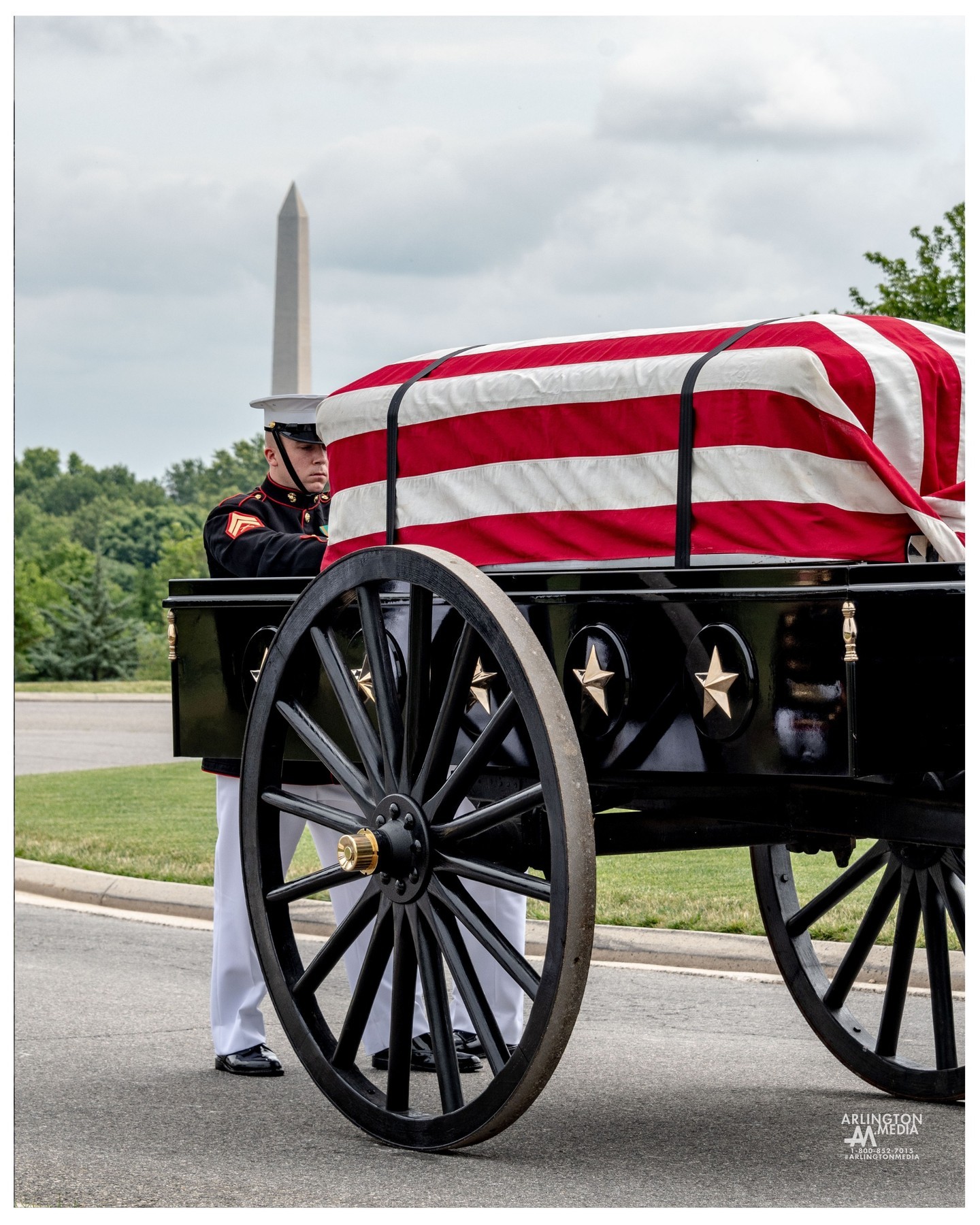 A caisson stops in the shadow of the Washington Monument during a US Marine service in Arlington National Cemetery.
