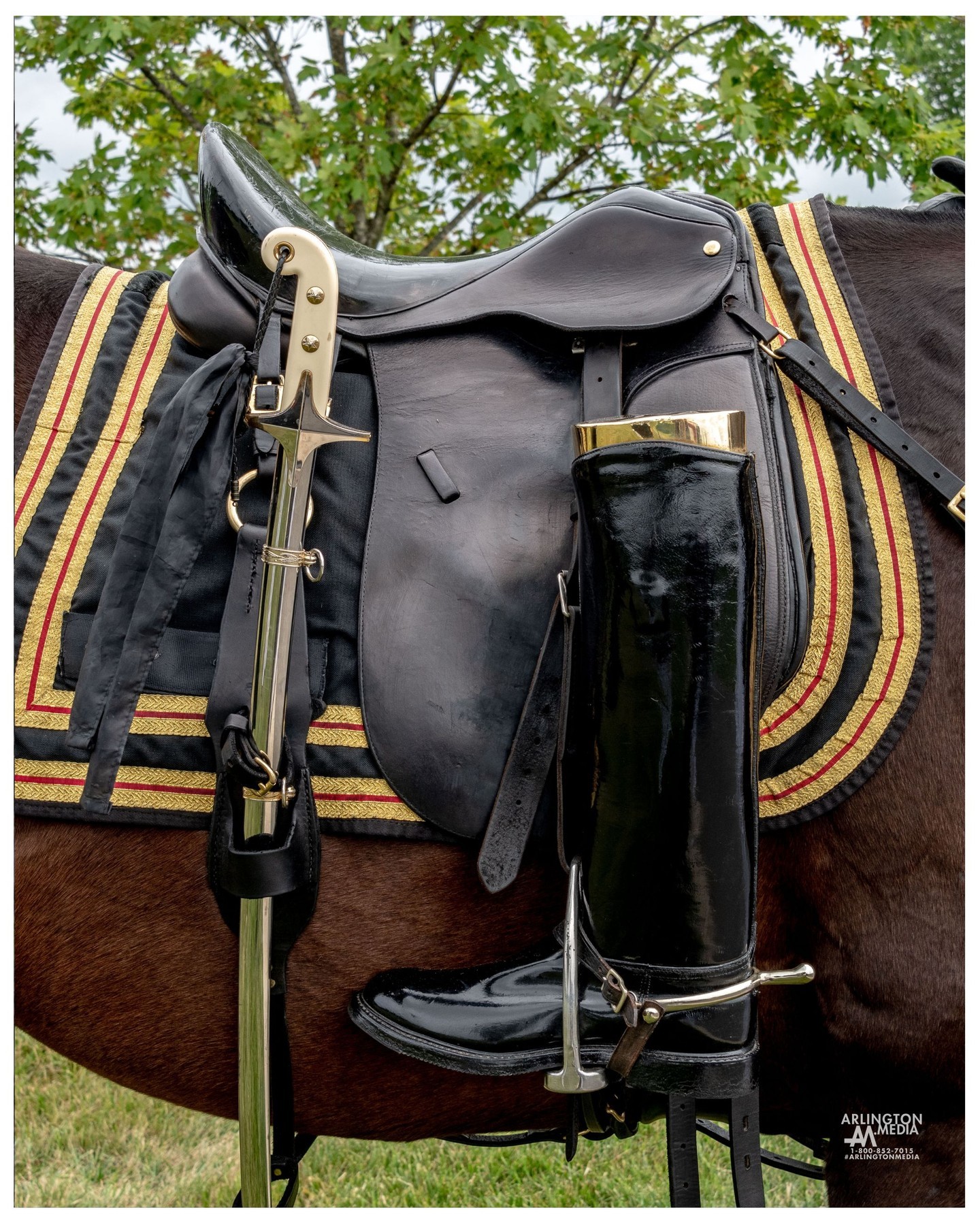 A detailed image of the comparison horse’s stirrups at a funeral in Arlington National Cemetery.

According to Army tradition, a ceremonial horse is led by a "cap walker," in a procession with boots set backward in the saddle's stirrups. In addition to high-ranking government officials such as the president, the cap horse honor is reserved for officers of the rank of colonel or above.

The tradition dates "to Roman times, or Genghis Khan," as a high honor bestowed on high-ranking fallen warriors." 

Today "the boots facing backward symbolize [that] the fallen won't ride again and [the rider is] looking back on his family one last time,".