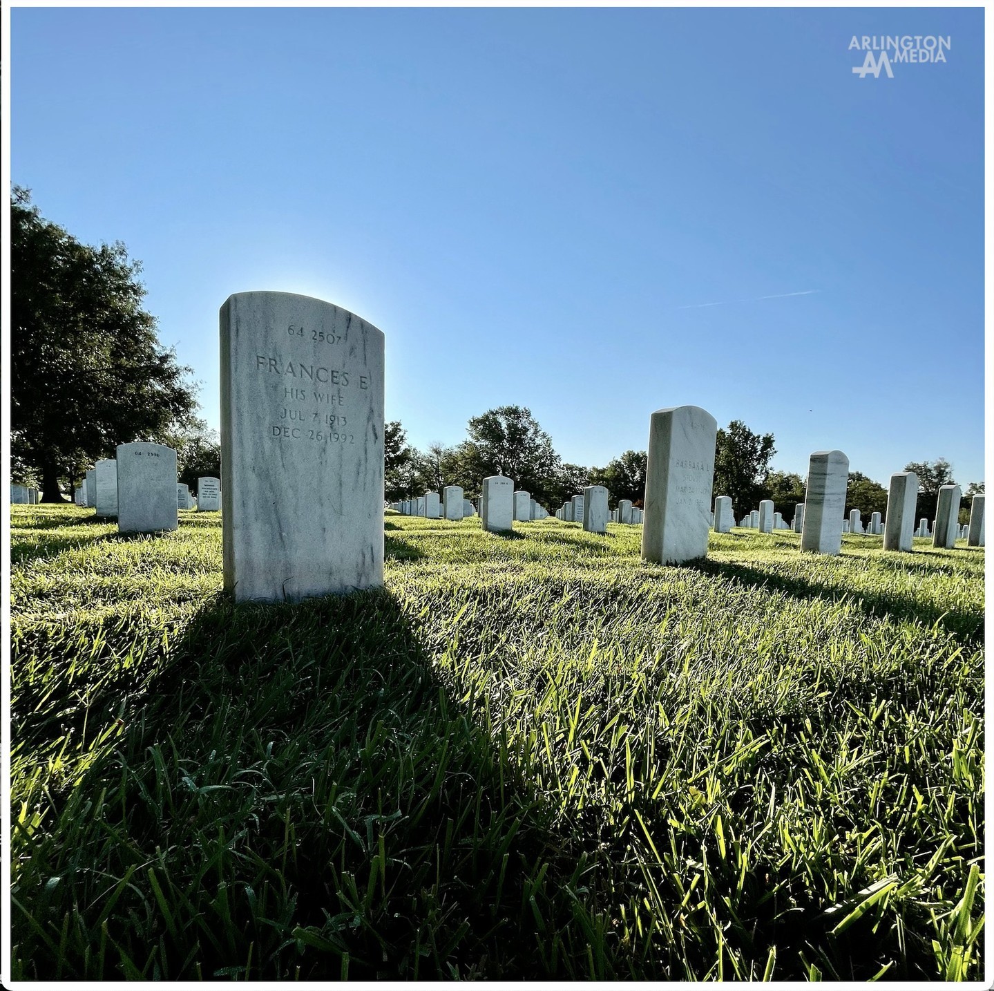 The sun rises at Arlington National Cemetery over the graves of an honored United States Air Force Veteran and his spouse buried in Section 64 of Arlington National Cemetery. 

Section 64 is also home to the Pentagon Group Burial Marker.  It is located in the southeastern part of the cemetery, closest to the Pentagon.  This burial marker was placed following a funeral service to honor all 184 victims, while offering special recognition of the five families who did not receive any recovered remains of their loved ones. 

A five-sided granite group marker stands over the gravesite, bearing the names of all those who perished in the Pentagon or aboard American Airlines Flight 77.