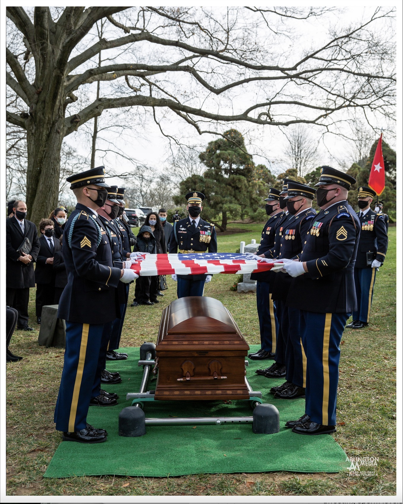 A US Army infantry company prepares to fold a flag at the funeral service of a General Officer in Arlington National Cemetery.