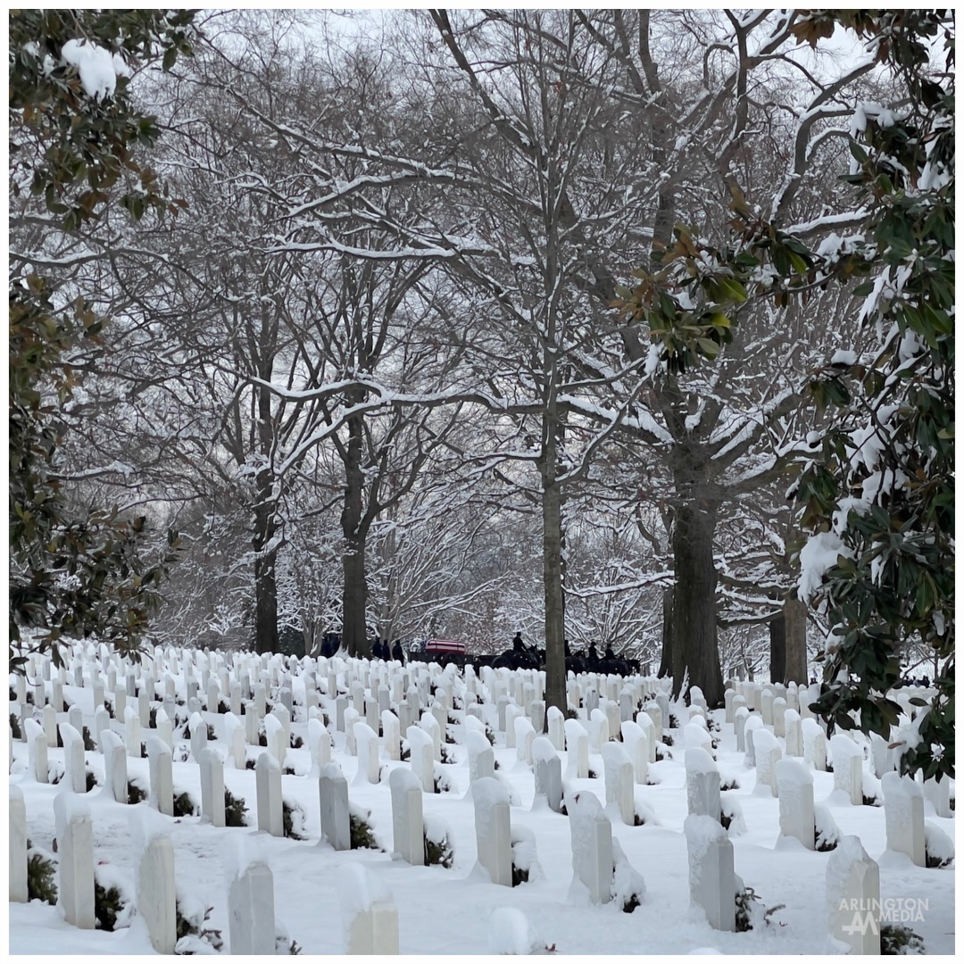 A caisson team can be seen through the snowy haze, escorting the remains of an honored veteran to their final resting place in Arlington National Cemetery.

PC: @arlingtonmedia