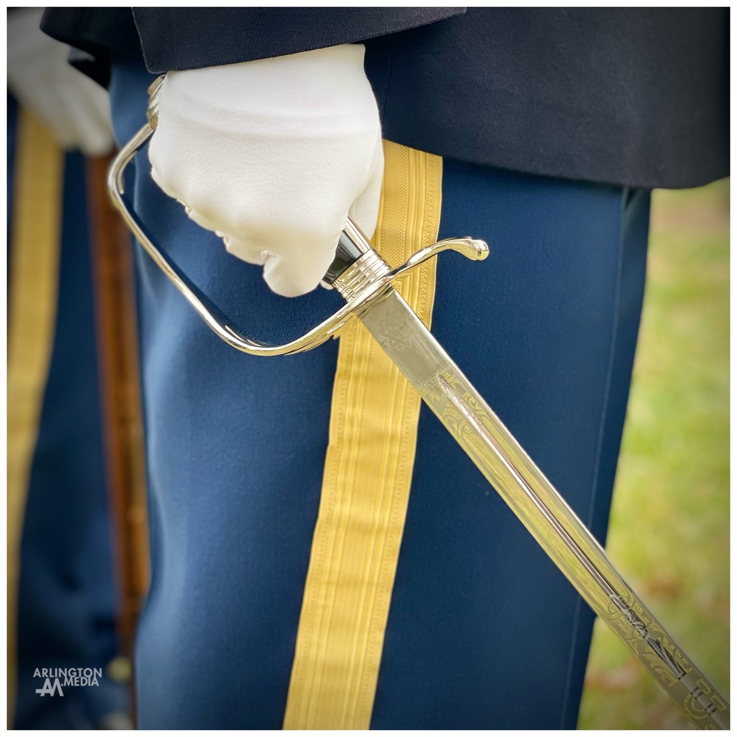 A member of the 1st Battalion, 3d US Infantry Regiment (The Old Guard) holds his saber during a US Army service in Arlington National Cemetery.

Officers arriving to The Old Guard spend weeks training and practicing as part of their initial tasking to the unit.  They learn how to execute formations, movements, and standard ceremonial procedures that are part of Dependent, Standard Honors, and Full Honors services at Arlington. 

Learning proper saber positioning and movements is critical to an individual soldier and his or her platoon being cemetery ready to honor America's fallen heroes to the best of their abilities.