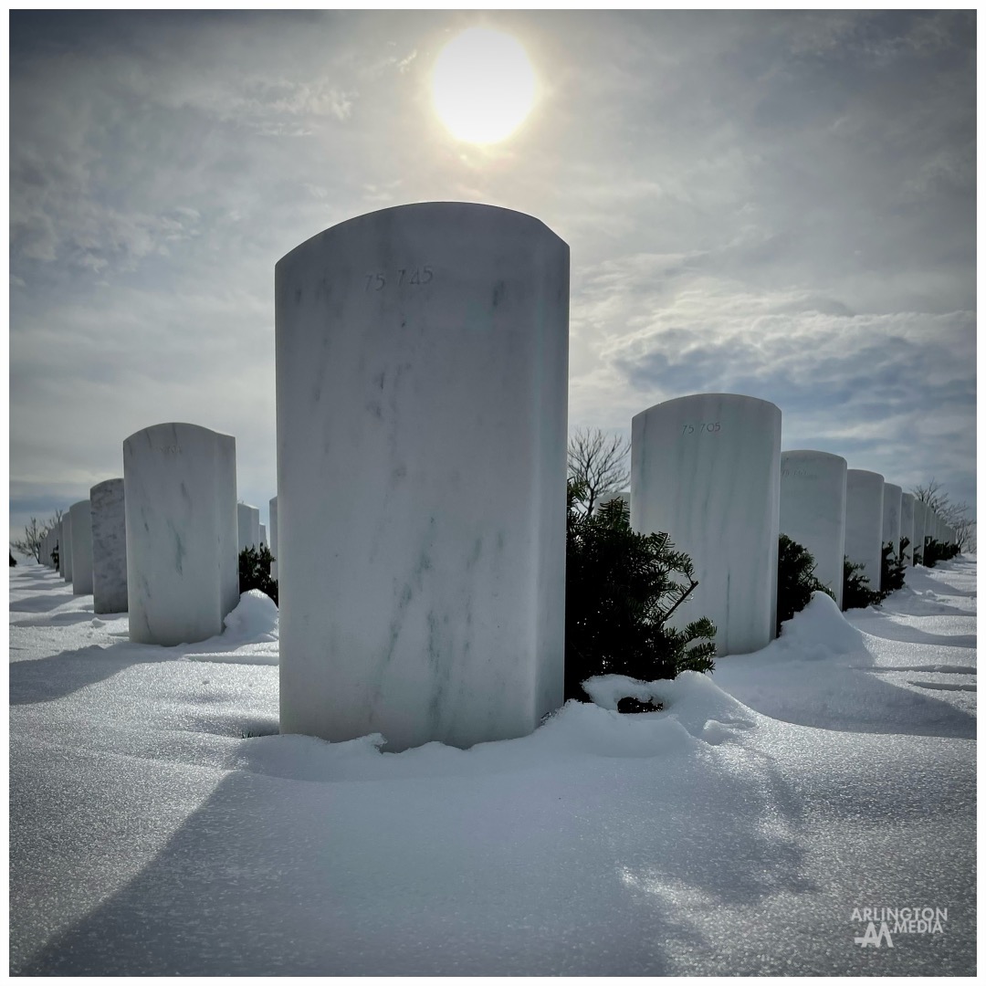 The sun illuminates the front of a headstone in Section 75 of Arlington National Cemetery.

Section 75 at Arlington National Cemetery was part of the cemetery’s 1968 expansion and is a section that Arlington Media frequents regularly to capture current services for loved ones in America's most hallowed grounds.