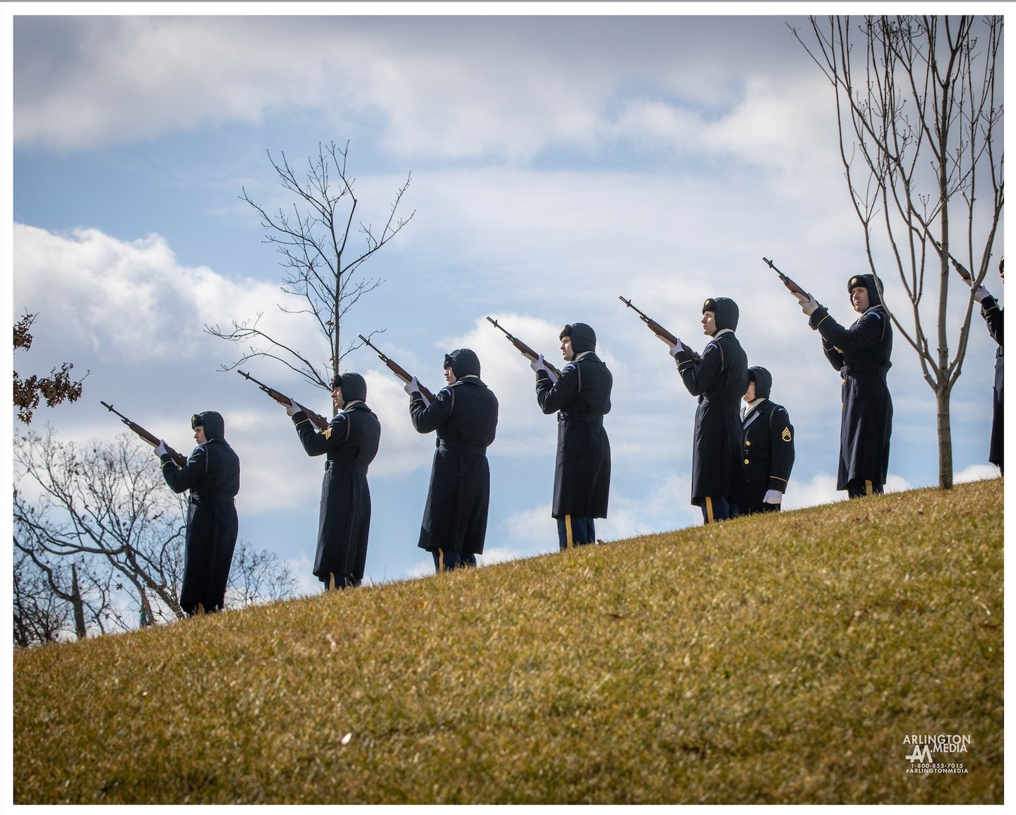 A firing party fires 3 volleys during a service in Arlington National Cemetery.