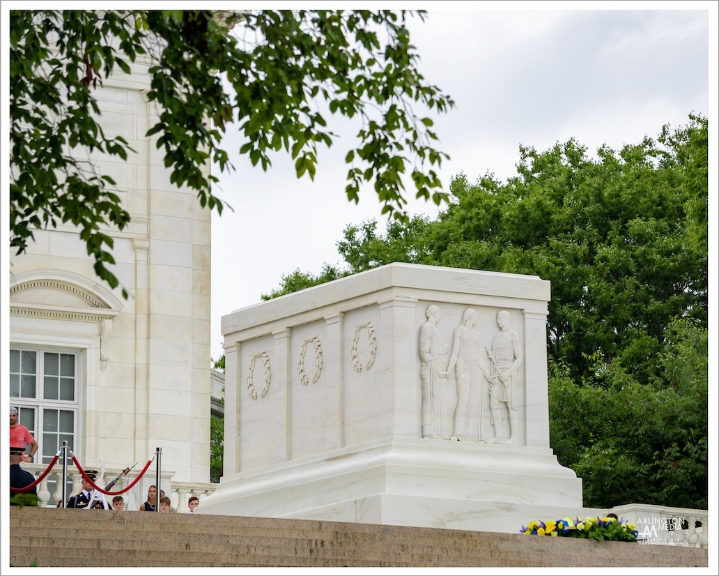 The Tomb of the Unknown Soldier stands on the top of a hill overlooking Washington DC in Arlington National Cemetery. Congress approved the burial of an unidentified World War I soldier in the plaza of the then-new Memorial Amphitheater in 1921.

The white marble sarcophagus has three Greek figures sculpted on the side representing Peace, Victory, and Valor. There are also six wreaths, three sculpted on each side, that represent the six major campaigns of World War I. On the back on the tomb, there is an inscription that reads: Here rests in honored glory an American soldier known but to God.

PC: @arlingtonmedia