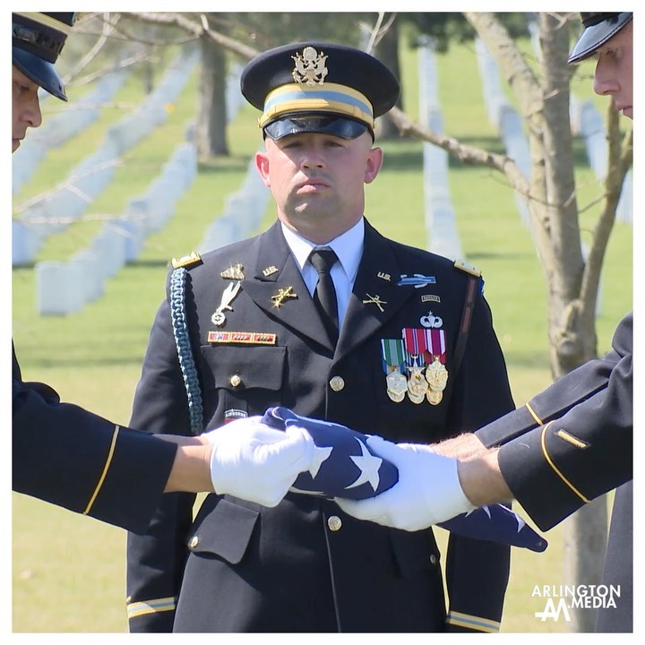 Old Guard Soldiers fold a flag over a casket in Arlington National Cemetery captured by our @arlingtonmedia team.