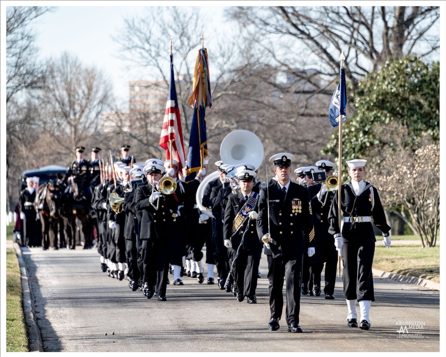 The US Navy band pictured leading a procession in Arlington National Cemetery during a full honors funeral.

Full honors funerals are for commissioned officers, warrant officers and senior non-commissioned officers (pay grade E-9). Full honors includes an escort platoon (size varies according to the rank of the deceased) and a military band pictured here. Normally, the deceased service member’s branch of service is responsible for carrying out the military honors at the funeral. Those eligible for full military honors may also use the caisson if it is available.

The Third Infantry Regiment United States Army, more commonly known as the Old Guard, is always responsible for caisson. Caisson is a horse drawn wagon or cart. The two caissons used at the Cemetery are from the WWI time period circa 1918-1919. Originally the caisson was used to bring artillery onto the battlefield. Once the artillery was off-loaded, the caisson was loaded with bodies of fallen service members. The wagon is pulled by six horses, but there are only three riders. 

The Old Guard service members only ride the horses on the left side because the horses on right side were originally used to take supplies onto the battlefield.

Officers with a rank of colonel or above in the Army and the Marine Corps may have a caparisoned (riderless) horse, if available. The riderless horse follows behind the caisson and is guided by an Old Guard service member. The horse wears an empty saddle with the boots in the stirrups backwards to signify the last ride of the officer.

PC: @arlingtonmedia
Paraphrased content: Arlington Tours